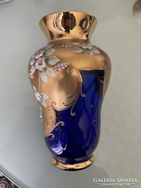 Czechoslovak blue glass vase decorated with Bohemian plastic flowers.