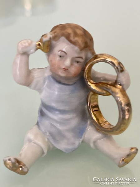 Antique rare porcelain little girl with hoops beautifully painted.