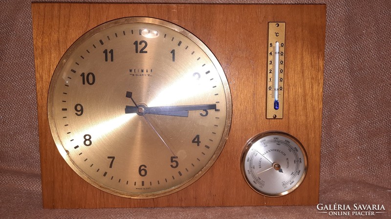 Old clock with thermometer and barometer
