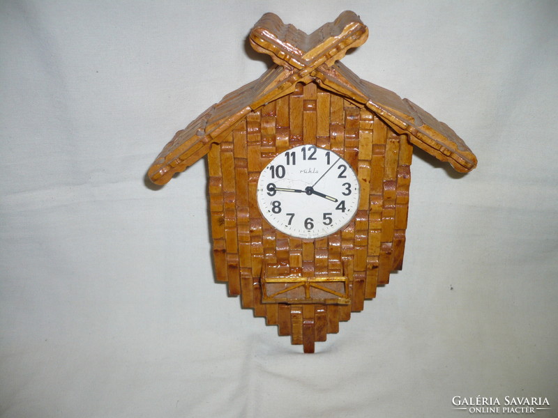 Old wooden wall clock alarm clock with wind-up cloth structure