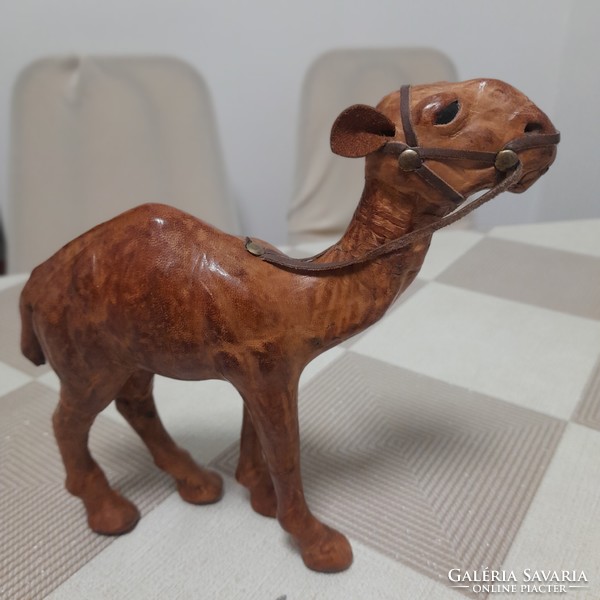Hand-carved, leather-covered camel statue
