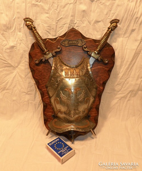 Noble breastplate with swords, wall decoration.