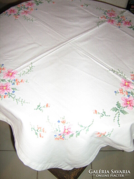 Beautiful vintage colorful floral hand embroidered cross on white tablecloth