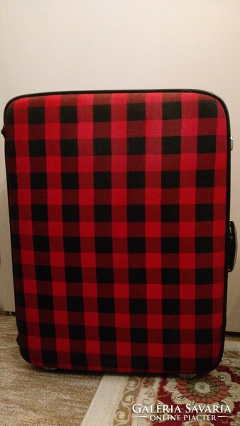 Retro giant suitcase - a massive, rolling, hard-lidded, checkered textile-covered suitcase
