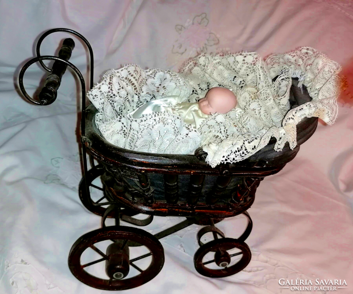 Vintage pram with sleeping porcelain baby doll. Very nice!