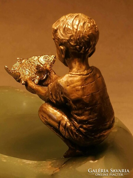 The goldfish and the boy bronze statue