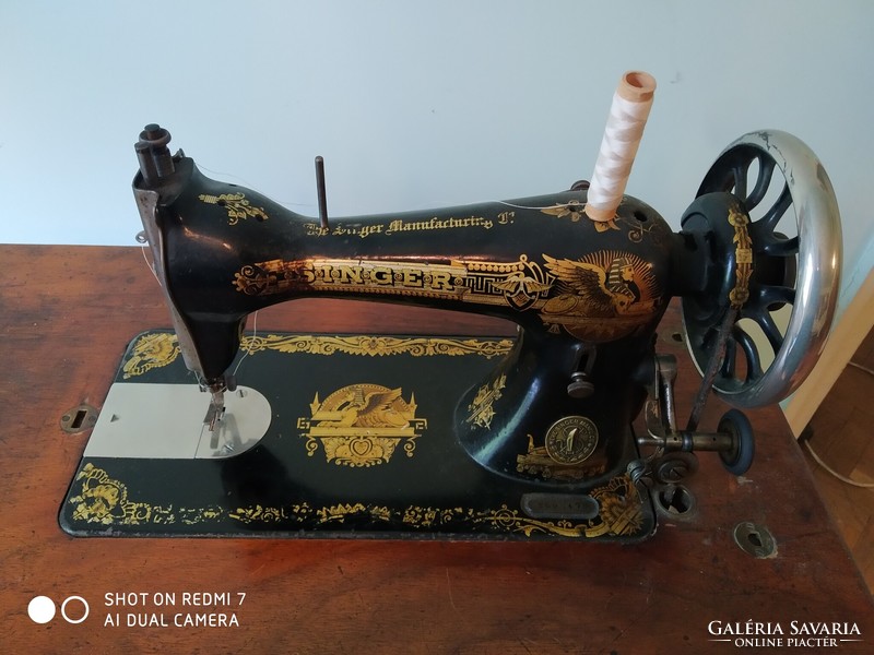 Singer sewing machine with wrought iron stand