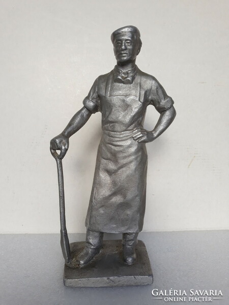 Old socialist metal worker metal statue