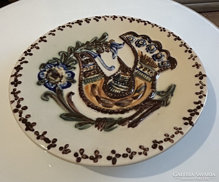Richly decorated glazed ceramic decorative wall plate