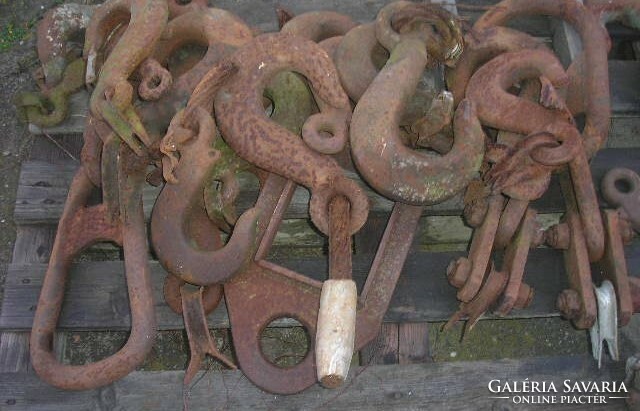 Old heavy crane hooks of various strengths for lifting ships, etc., etc