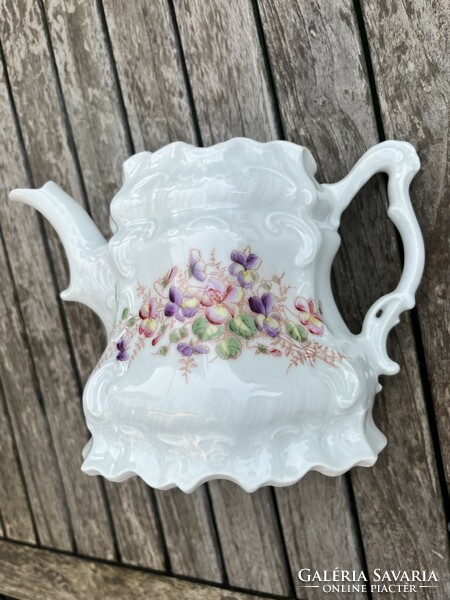 Beautiful old tea pot with violets