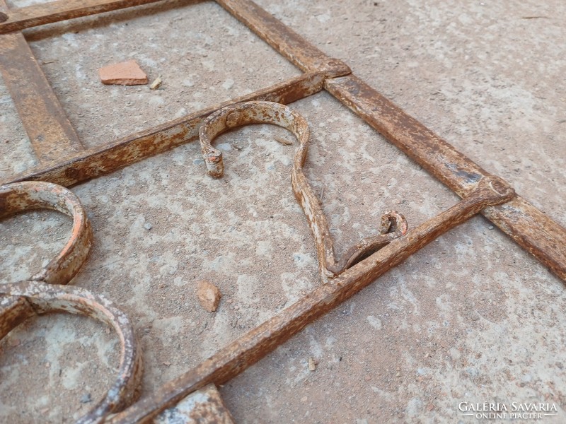 Old wrought iron window grill 1882.