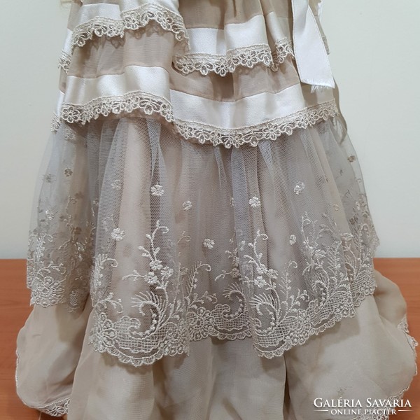 Porcelain doll in a wonderful dress