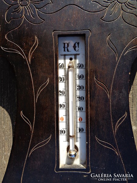 Barometer and thermometer on wooden flower decorated base