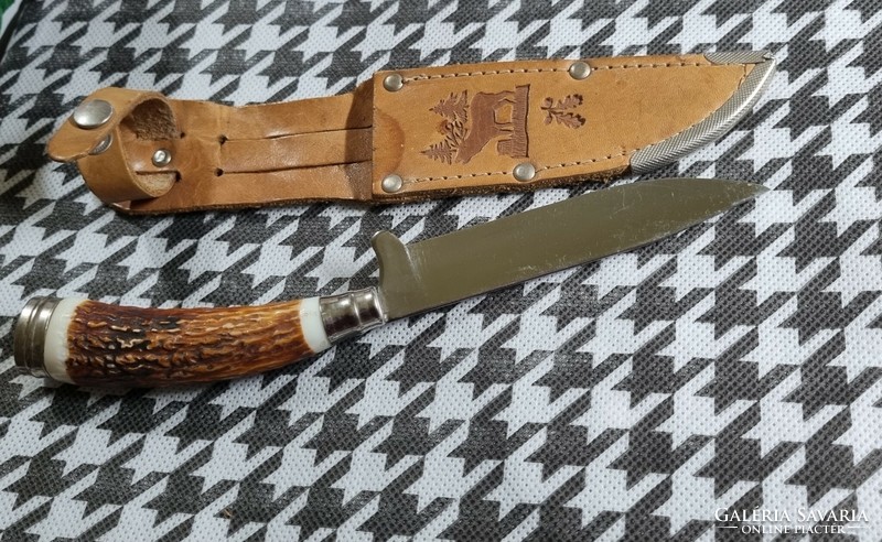 Old hunting dagger with leather sheath
