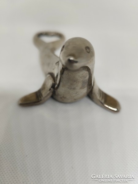 Figural metal seal beer opener, beer opener.