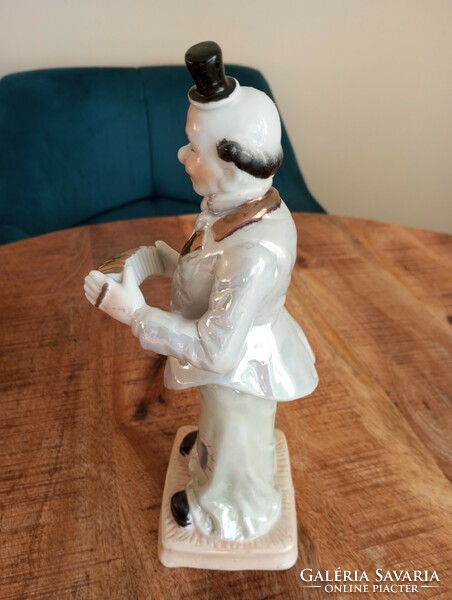 Large Russian porcelain clown figure with accordion