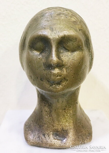 Bronze female head, on a marble base