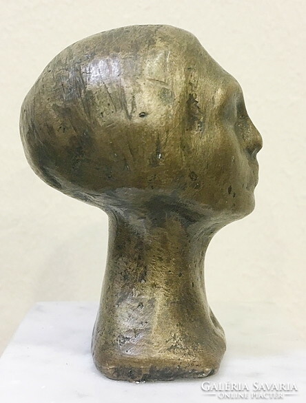 Bronze female head, on a marble base