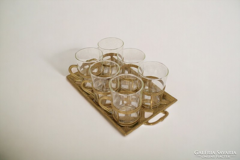 Vintage glass tea glasses in a copper holder and copper tray