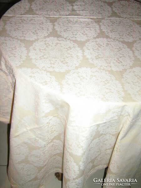 White floral damask tablecloth on a beautiful yellow background