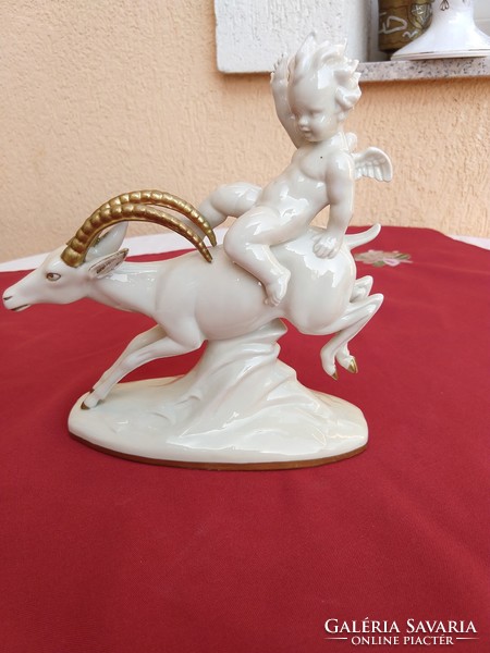 A putto riding a stone goat, a small putto with wings, an angel, very rare, flawless, no minimum price.