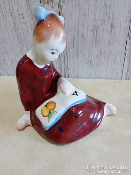 Bodrogkeresztúr ceramic figurine of a little girl getting acquainted with ABC