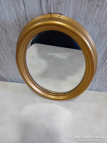 Mirror in an oval wooden frame