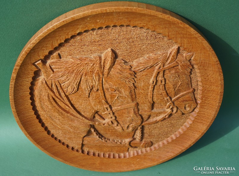 Representation of a horse carved into an oak disc horses horse portrait wood carving carved wall picture