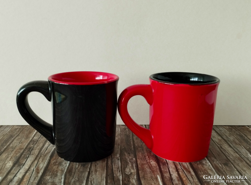 2 large ceramic mugs with a poker card pattern