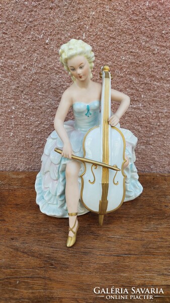 German porcelain figure, lady with cello, 23 cm