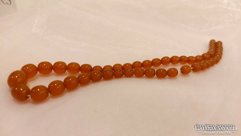 Russian art deco, honey colored amber necklaces.