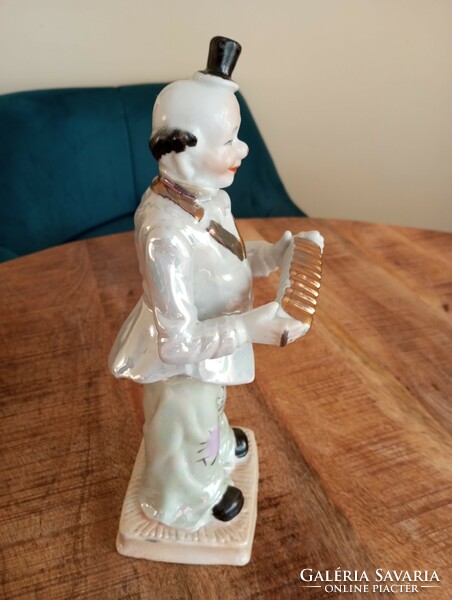 Large Russian porcelain clown figure with accordion