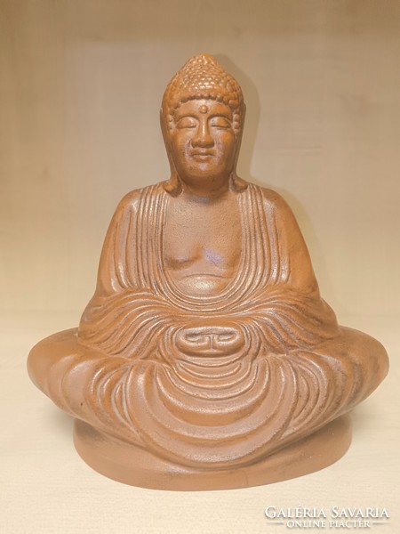 Meditating ceramic buddha