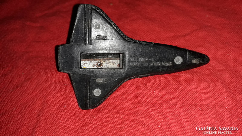 Old 1970s usa space plane pencil sharpener with metal casing as shown in the pictures
