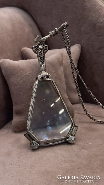 Antique silver lornyon on a silver necklace