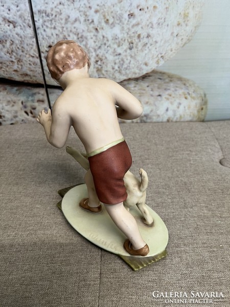 Royal dux biscuit porcelain statue of a boy playing with a dog a76
