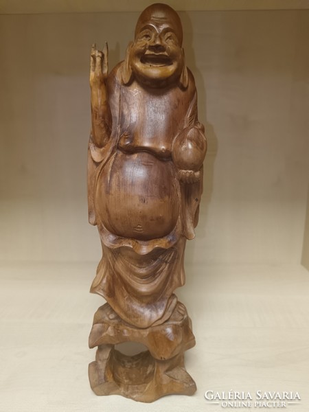 Large laughing Buddha made of wood