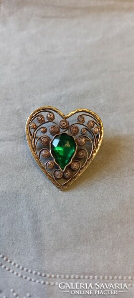 Antique silver brooch with green stone