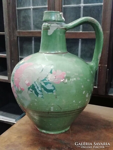 Old large green ceramic water jug