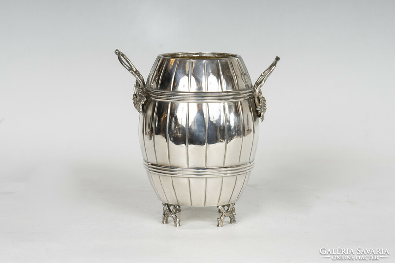 Silver barrel-shaped offering