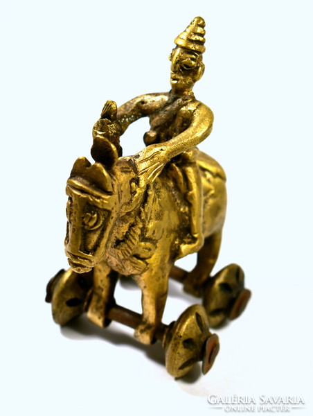 A replica of an ancient object? Horse figurine rolling on wheels solid copper!