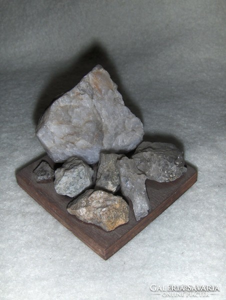 Mineral treasures of Switzerland on a wooden base