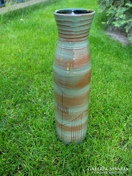 A ceramic vase by a great industrial artist, scratched and fired with images of houses.