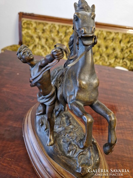 Equestrian bronze statue on a wooden base