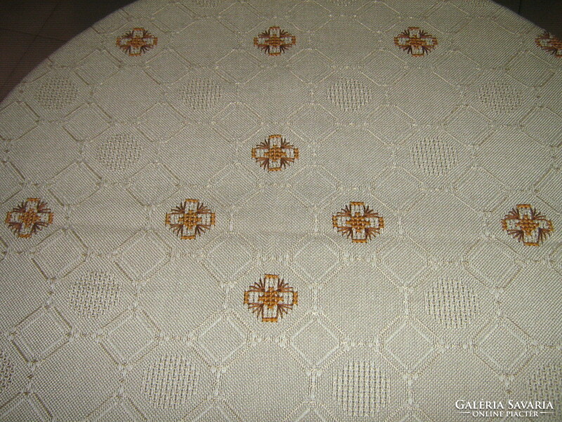 Beautiful elegant hand-embroidered woven tablecloth with lacy edging