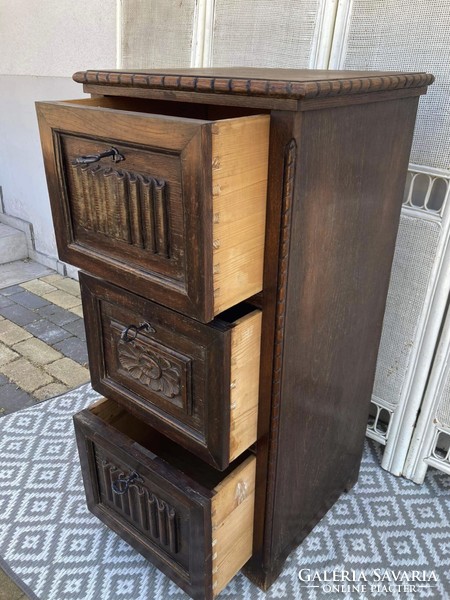 A special high chest of drawers with three deep drawers, it has a little oriental feel