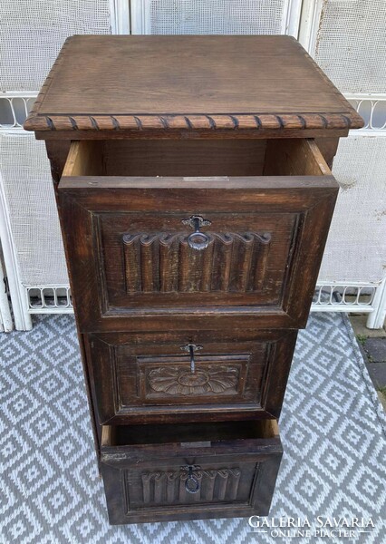 A special high chest of drawers with three deep drawers, it has a little oriental feel