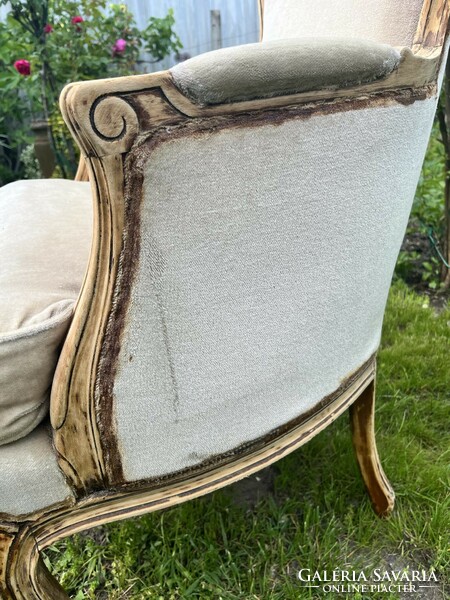 Beige antique armchair