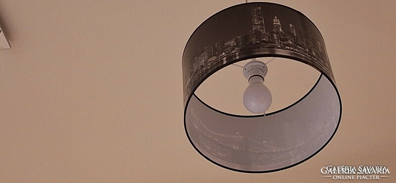 City skyscrapers, black and white ceiling lamp.